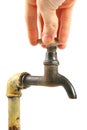 Hand turning the old rusty tap Royalty Free Stock Photo