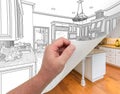 Hand Turning Page of Custom Kitchen Drawing to Photograph. Royalty Free Stock Photo