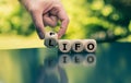 Hand turns a cube and changes the expression `fifo` to `lifo` Royalty Free Stock Photo