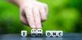 Hand turns dice and changea the expression `I hate DNC` Democratic National Committee to `I love DNC`.