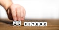 Hand turns dice and changes the expression `no future` to `your future`. Royalty Free Stock Photo