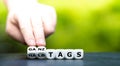 Hand turns dice and changes the German expression `halbtags` part time to `ganztags` full time. Royalty Free Stock Photo