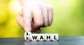 Hand turns dice and changes the German expression `2. Wahl` second choice to `1. Wahl` first choice.