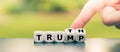 Hand turns dice and changes the name `Trump` to `Truth`. Royalty Free Stock Photo