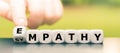 Hand turns dice and changes the word `sympathy` to `empathy`. Royalty Free Stock Photo