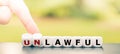 Hand turns dice and changes the word `unlawful` to `lawful`.