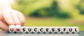 Hand turns dice and changes the word `unsuccessful` to `successful`.