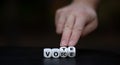 Hand turns dice and changes the word `voice` to `vote2: