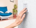 hand turns on the light in the house Royalty Free Stock Photo