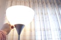 Turning on a lamp at home Royalty Free Stock Photo