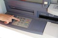 hand type the secret code in the keyboard of the ATM Royalty Free Stock Photo