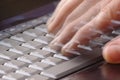 Hand typing fast on laptop keyboard Royalty Free Stock Photo