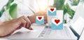 Hand typing keyboard with laptop computer with social media love letter mail send out icons valentine day Royalty Free Stock Photo