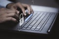 Hand typing on keyboard laptop computer to input username and password for or technology security system and prevent hacker Royalty Free Stock Photo