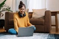 hand typing keyboard laptop online chatting search form internet while working sitting on floor.concept for work from Royalty Free Stock Photo