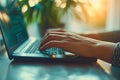 Hand typing on keyboard notebook