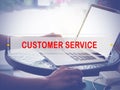 Hand Typing on keyboard with text CUSTOMER SERVICE