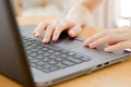 hand typing with laptop. focus on his finger Royalty Free Stock Photo