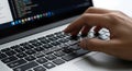Hand typing on laptop keyboard working coding secure password security data entry computer programmer developer Royalty Free Stock Photo