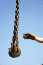 Hand of unknown worker with industrial crane chains Royalty Free Stock Photo