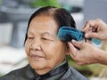 Hand use comb to dressing hair of a senior woman Royalty Free Stock Photo