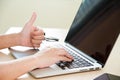 Hand use laptop with thumb Royalty Free Stock Photo