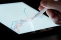 Hand use  pen stylus touch business graph  on Tablet screen Mock up with light. Concept for mobile phone technology and business Royalty Free Stock Photo