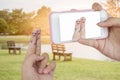 Hand use smart phone take photo funny finger lovers Royalty Free Stock Photo