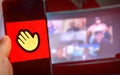 Hand use videoconference app icon of Houseparty . Royalty Free Stock Photo