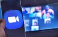 Hand use videoconference app icon of Zoom Meeting. Royalty Free Stock Photo