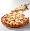 Stretchy Cheese Pull from a Delicious Hawaiian Pizza Slice Royalty Free Stock Photo