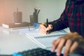 Hand using calculator Calculating bonusOr other compensation to employees to increase productivity, work from home, quarantine