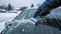 Hand using ice scraper on car windshield isolated on white background Royalty Free Stock Photo