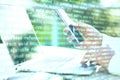 Hand using laptop and abstract coding text interface Royalty Free Stock Photo
