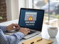 Hand Using Laptop with Warning Screen: New Email Alerts, Hacked Password & Personal Data Theft