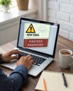 Hand Using Laptop with Warning Screen: New Email Alerts, Hacked Password & Personal Data Theft