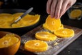 hand using a microplane to zest citrus over a tart Royalty Free Stock Photo