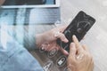 Hand using mobile payments online shopping,omni channel,icon customer network,in modern office wooden desk, graphic interface Royalty Free Stock Photo