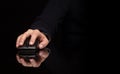 Hand using mouse on dark background Royalty Free Stock Photo