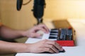 Hand using mouse and sound mixing console board. Equipment for the music studio Royalty Free Stock Photo