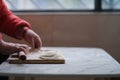 Hand using rolling pin making dumpling wrapper Royalty Free Stock Photo