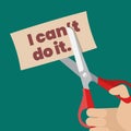 Hand using scissors to remove the word can`t to read I can do it