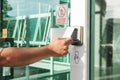 Hand using security key card scanning to open the door to entering private building. Home and building security system Royalty Free Stock Photo