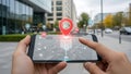 Hand using smartphone with augmented reality city map overlay Royalty Free Stock Photo