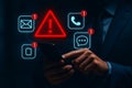 Hand using smartphone with digital warning alerts, cybersecurity risk, data breach, online threats, privacy protection concept. Royalty Free Stock Photo