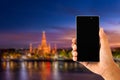 hand using smartphone with view of watarun thailand