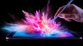 A hand using a stylus on a digital tablet creates a vibrant explosion of colorful particles against a dark background Royalty Free Stock Photo