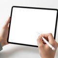 Hand using stylus on digital tablet screen Royalty Free Stock Photo