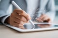Hand using stylus on tablet with digital icons representing communication and creativity Royalty Free Stock Photo