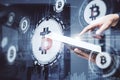 Hand using tablet and bitcoin icon with business statistic Royalty Free Stock Photo